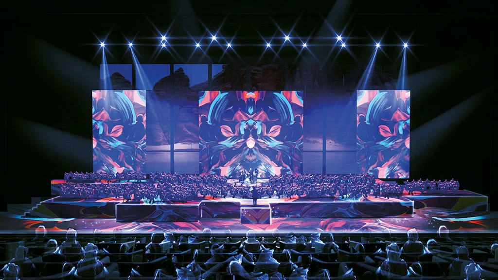 Render di un concerto nella sala: orchestra sul palco, schermi colorati e riflettori sopra il pubblico – Maraya Concert Hall, AlUla, Arabia Saudita, 2019 – architettura