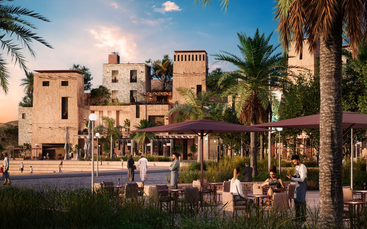 Render della terrazza di un caffè con ombrelloni viola e palme davanti a case-torre in pietra – Khor Grama, Oman, 2023 – masterplan