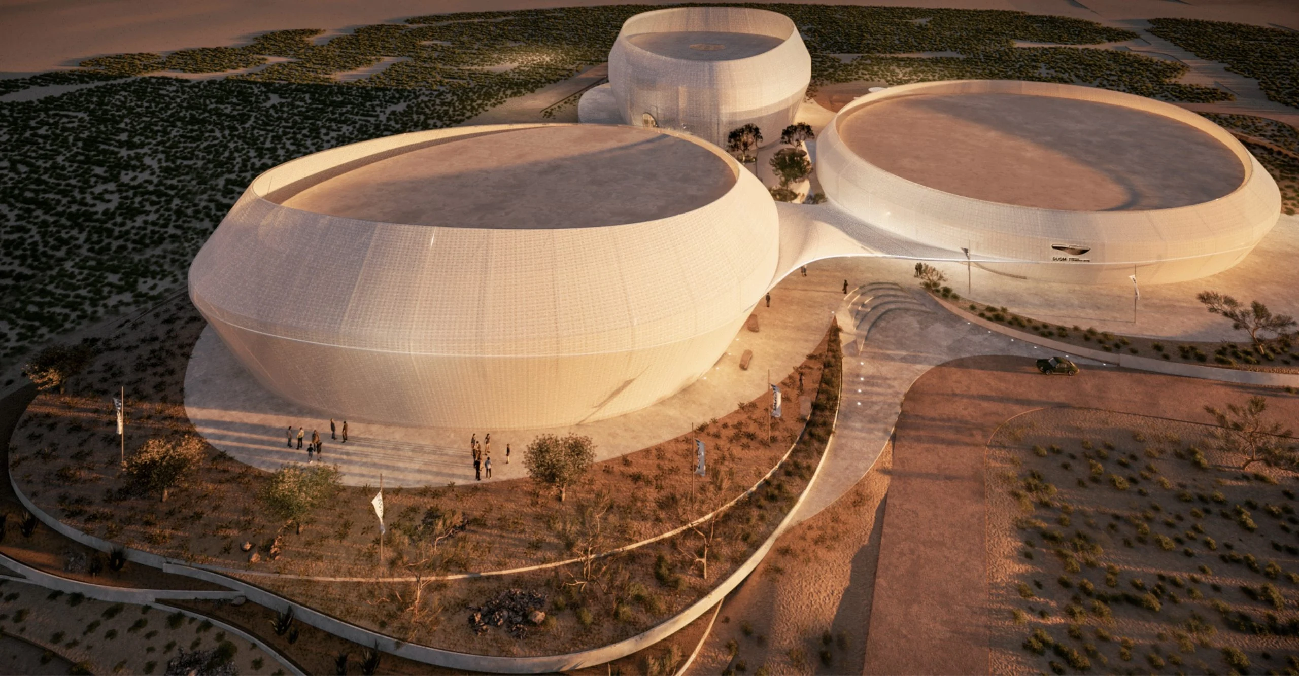 Render aereo del centro congressi di Duqm: tre volumi bianchi arrotondati collegati da una pensilina nel deserto – Duqm Exhibition & Convention Center, Oman, 2024 – architettura