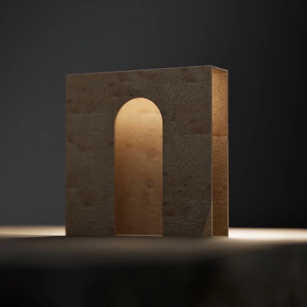 Blocco di pietra con un'apertura ad arco illuminato dall'interno su sfondo scuro – Arredi in porfido Porfido Pedretti, Milano, Italia, 2025 – design di prodotto