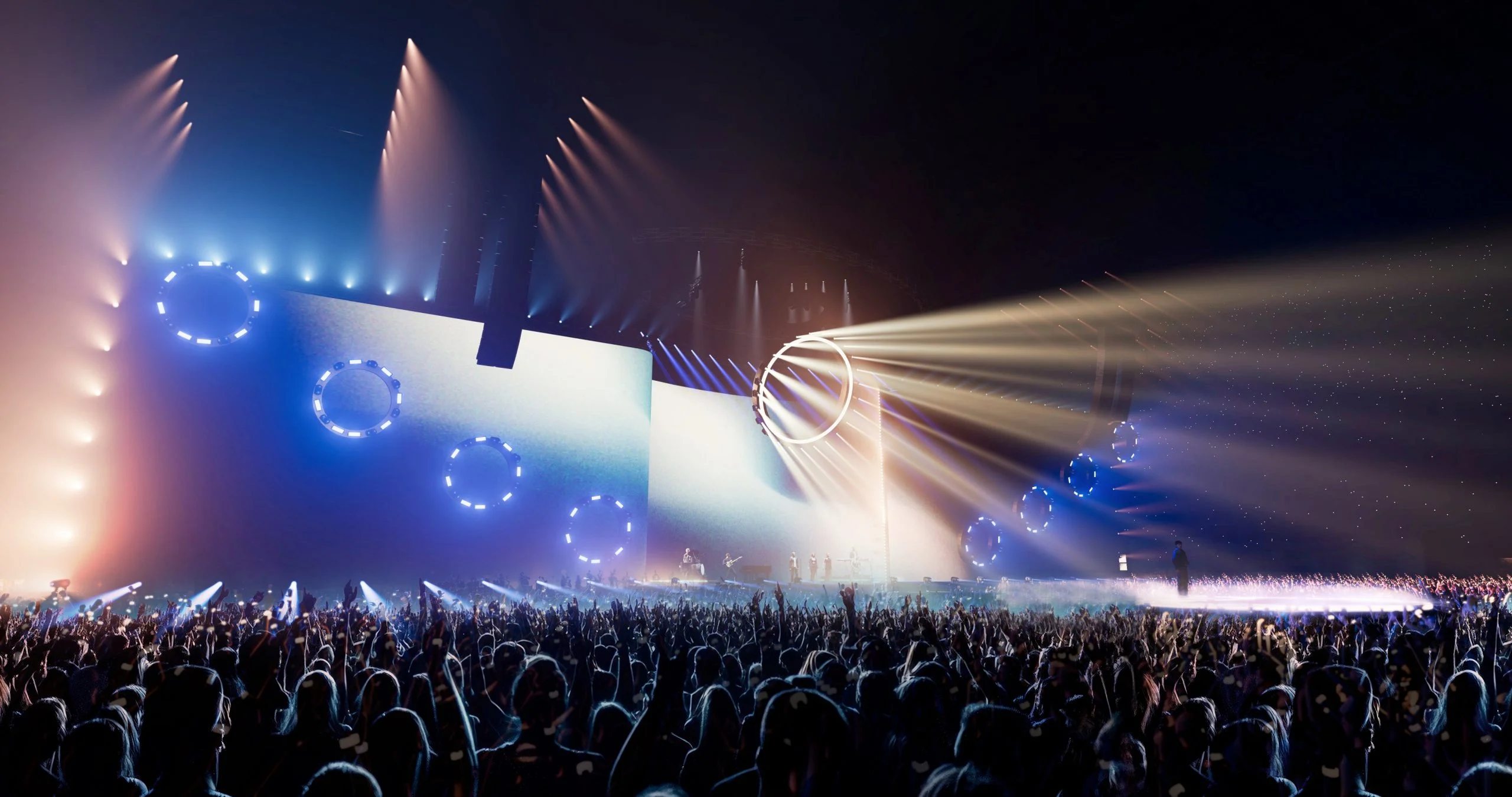 Render della parete del palco con anelli di luci blu e fasci caldi che attraversano il pubblico – Cesare Cremonini Live25, Italia, 2025 – scenografia per concerti