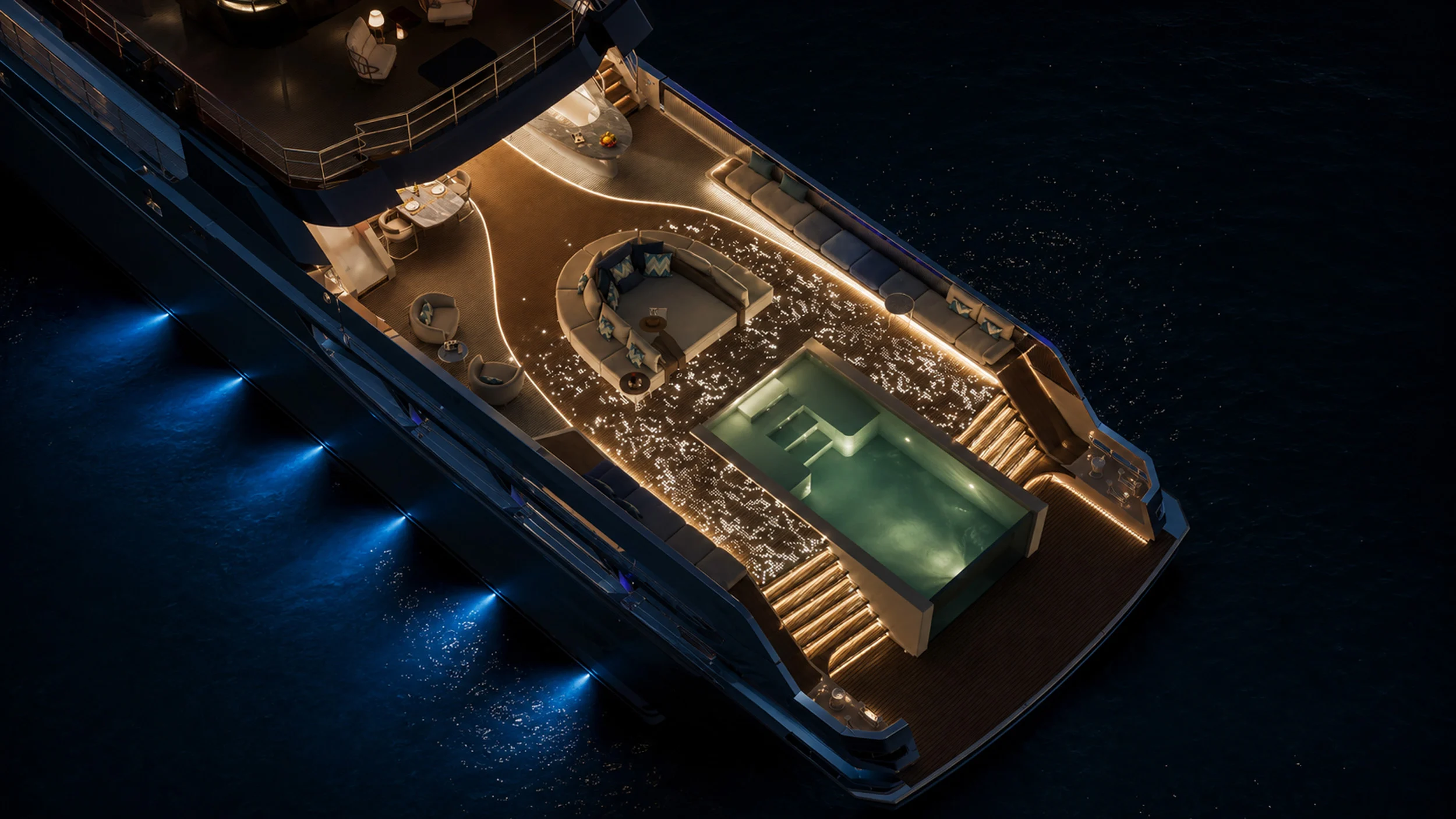 Render del ponte di poppa dall'alto di notte: piscina luminosa, pavimento illuminato e luci blu lungo lo scafo – Morricone Reloaded, Flexplorer 146, 2026 – interior design di yacht, concorso